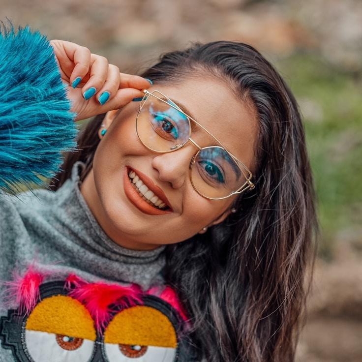 Kaveri Mehta, Lead Design Curator at BrookStoneGallery, reviewing corporate floral arrangements